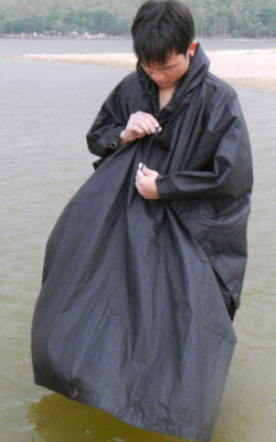 Swimming in hiking poncho